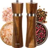A set of wooden salt and pepper grinders with accompanying spices. Náhled obrázku produktu