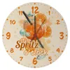A round clock face with an illustration of a cocktail and the text 'It's Spritz o'clock'. Produktbild-Vorschau