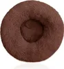 A brown, plush, round pet bed with a raised rim.