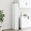A tall, white apothecary cabinet stands in a room with a plant to its left and kitchen cabinets to its right. Produktbild-Vorschau
