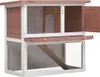 A two-tiered wooden rabbit hutch with a ramp and an open door. Náhľad obrázku produktu