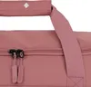 A close-up view of the zipper and handles of a rose-colored travel bag. Produktbild-Vorschau