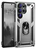A silver and black rugged phone case with a ring holder is shown next to a smartphone displaying a forest scene and time. Produktbild-Vorschau