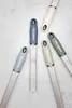 A collection of Microplane graters with colored handles arranged on a light gray surface. Náhled obrázku produktu