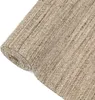 A close-up, rolled-up view of a textured rug. Produktbild-Vorschau