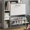 A shoe cabinet with a flip-down shoe storage compartment and shelves. Produktbild-Vorschau