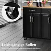 A close-up view of a black kitchen cart with a wooden countertop, highlighting its wheels and drawers. The image includes text overlays describing the features of the wheels. Náhľad obrázku produktu