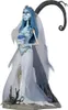 A figurine of Emily from Corpse Bride standing on a base with a tree branch behind her. Náhled obrázku produktu