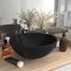 A black ceramic sink on a wooden countertop with various toiletries and decorative elements. Náhled obrázku produktu