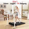 A woman is walking on a treadmill desk in a home office setting. Produktbild-Vorschau