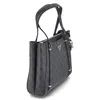 A dark gray Guess shopper bag with a repeating logo pattern, shown from a side angle against a white background. Produktbild-Vorschau