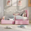 A pink upholstered bed with bedding and pillows in a bedroom setting. Produktbild-Vorschau