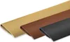 Three pieces of trim in different colors laid out diagonally on a white background. Produktbild-Vorschau