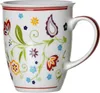 A white ceramic mug with a colorful floral and paisley pattern. Náhľad obrázku produktu