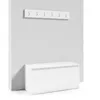A white hallway set with a coat rack and a shoe cabinet against a light gray wall. Produktbild-Vorschau