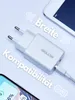 A white USB charger is shown with a tablet and a smartphone. Náhled obrázku produktu
