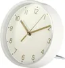 A close-up, side view of a white analog alarm clock with a cream-colored face and gold hands. Podgląd zdjęcia produktu