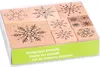 A set of snowflake-shaped rubber stamps in a clear plastic box with a green label. Produktbild-Vorschau