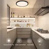 A modern kitchen with a ceiling light, shelves, and cabinets. Náhled obrázku produktu