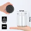 A hand holding a lid and a glass jar with dimensions shown. Voir les images du produit