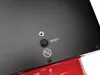 A close-up view of the back panel of a red and black heater, showing a reset button and a symbol. Produktbild-Vorschau