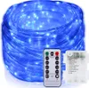 A coiled string of blue LED lights with a remote control and battery pack. Produktbild-Vorschau