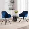 Two blue velvet chairs are placed in a living room setting with a small black table between them. Produktbild-Vorschau
