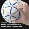 A hand is holding a white and blue handball with gold accents. Produktbild-Vorschau