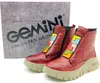 A pair of red Gemini women's ankle boots with colorful geometric accents and a textured sole, placed next to their branded packaging. Produktbild-Vorschau