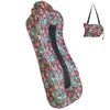 An inflatable lounger and a folded version of it in a bag. Produktbild-Vorschau