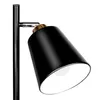 A close-up shot of a black floor lamp with a gold accent, showing the adjustable lamp head. Náhled obrázku produktu