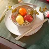 A table setting with Easter eggs and cutlery. Produktbild-Vorschau