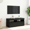 A black TV stand with a TV mounted above it, in a room setting. Náhled obrázku produktu