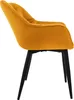 A side view of a single mustard yellow velvet dining chair with black legs, isolated on a white background. Náhled obrázku produktu