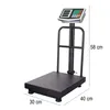 A digital scale with a platform and a display screen, shown against a white background with dimensions indicated. Voir les images du produit