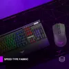 A gaming keyboard and mouse are placed on a large mousepad with a geometric pattern. The background is a gradient of purple. Anteprima dell’immagine prodotto