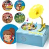 A collage of a blue toy record player with several circular inserts depicting children's stories and songs, and a girl wearing headphones. Náhľad obrázku produktu