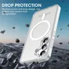 A clear phone case with a magnetic ring is shown on a rocky, uneven surface with debris falling around it, against a blue sky background. Voir les images du produit