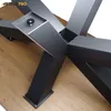 Close-up view of a metal table base on a wooden surface. Produktbild-Vorschau