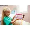 A young girl playing with a toy. Voir les images du produit