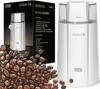 A coffee grinder is shown next to its packaging, with coffee beans scattered in the foreground. Náhled obrázku produktu