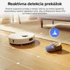 A robot vacuum cleaner is shown navigating a living room floor, avoiding a slipper. Text overlays provide information about its obstacle detection capabilities. Náhľad obrázku produktu