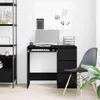 A black wooden desk with a monitor, keyboard, and drawers, set up in a home office environment. Produktbild-Vorschau