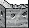 A close-up view of a drill bit with a textured surface and circular openings. Anteprima dell’immagine prodotto