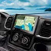 The dashboard of a vehicle with a navigation system displaying a map, with a scenic ocean view in the background. Podgląd zdjęcia produktu