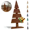 A wooden Christmas tree decoration with a circular inset showing two similar decorations in a living room setting. Anteprima dell’immagine prodotto