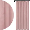 A pink velvet curtain hanging from a curtain rod. Podgląd zdjęcia produktu