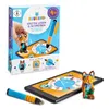 A product box for a children's learning game, along with the game's components (a tablet, a stylus, and a figurine) displayed next to it. Produktbild-Vorschau