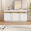 A white sideboard with gold accents is displayed in a well-lit room, with a rug and books in the foreground and a framed picture and decorative items on top. Anteprima dell’immagine prodotto