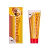 A product shot of a box and a tube of creme-balsam. Produktbild-Vorschau